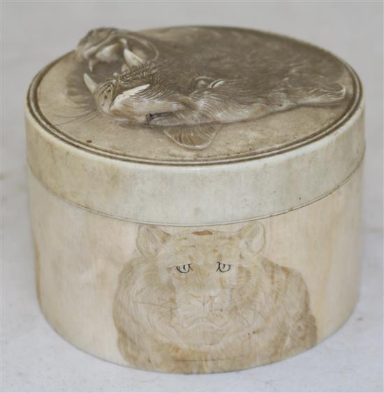 A Japanese ivory circular box and cover, early 20th century, diameter 9.5cm, re-glued